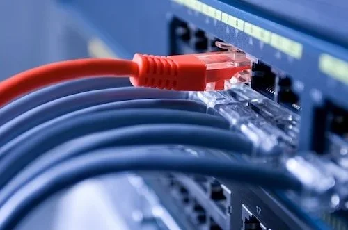 Ethernet cables plugged into a machine