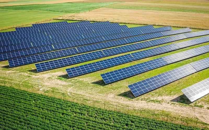 Solar panels in a green field