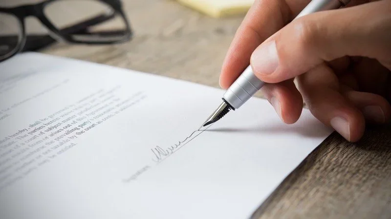 Person signing a document