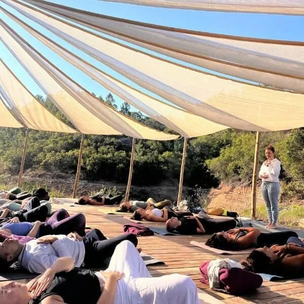 Yoga teacher training Portugal outdoor practice by lake