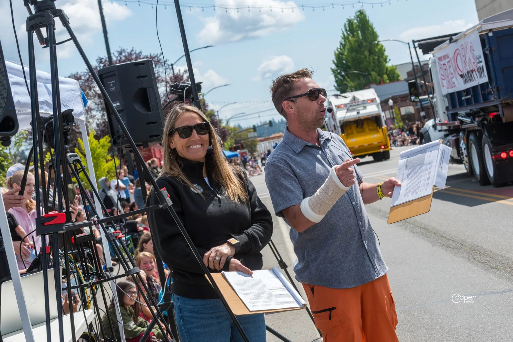 Jeff Slakey emceeing a community parade event, photo by Cooper Studios