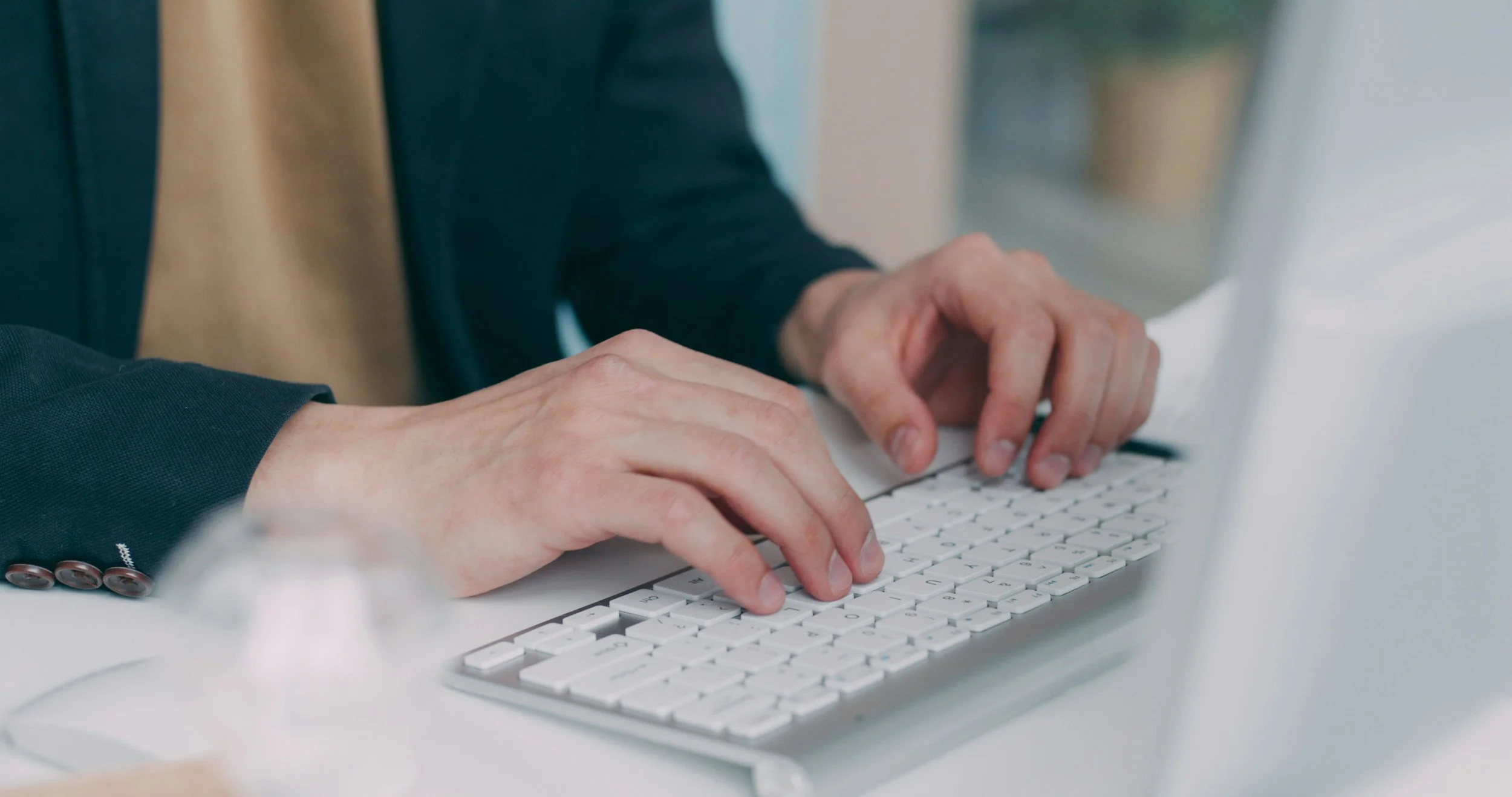 Undergraduate typing on keyboard