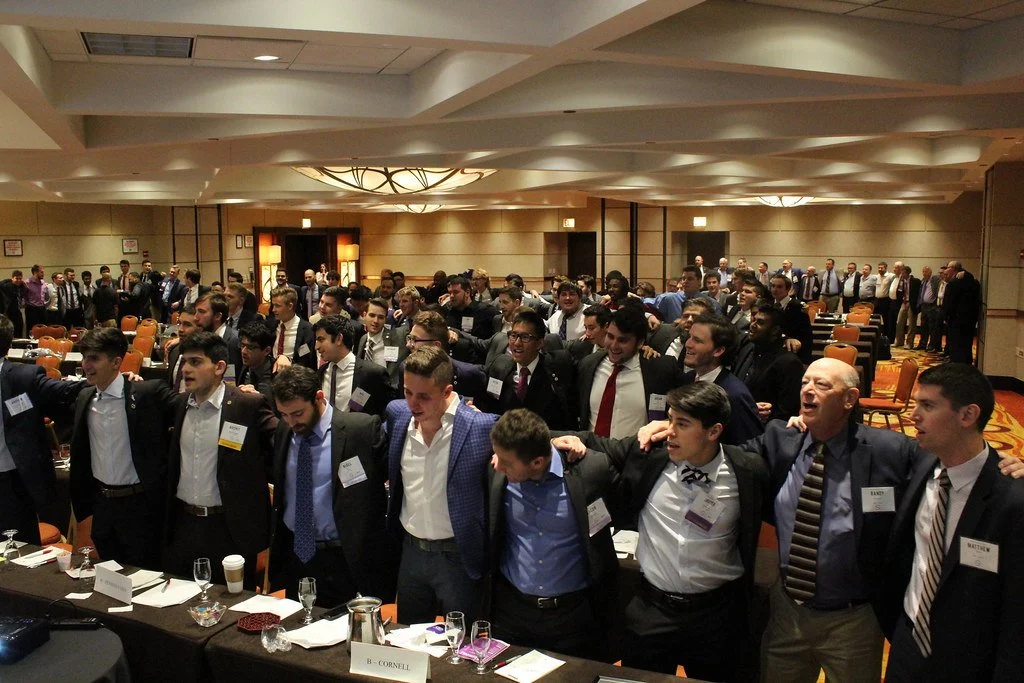 Undergraduate and alumni members singing SAM song