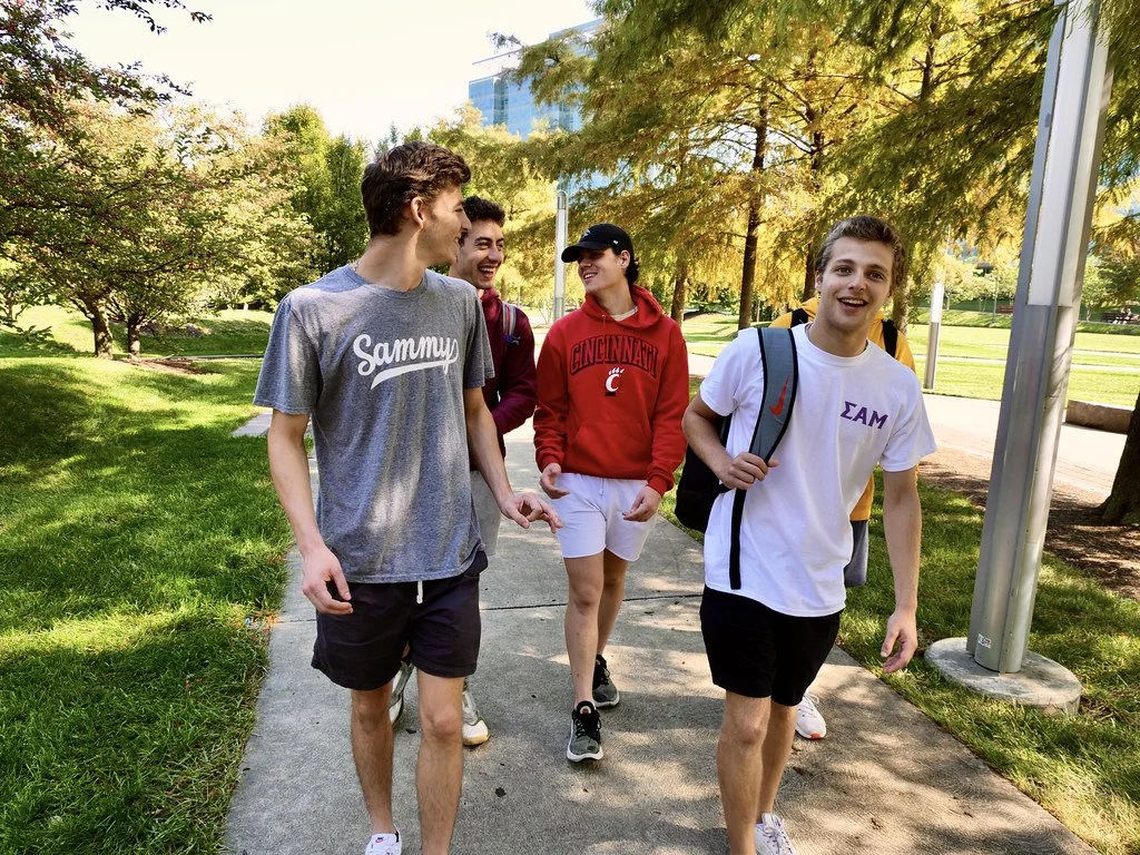 Undergraduate fratres walking on campus