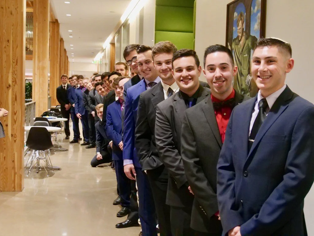 Undergraduates lined up in suits