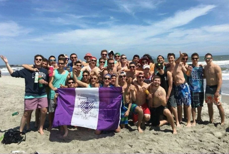 Epsilon Xi at Emory around Sammy flag