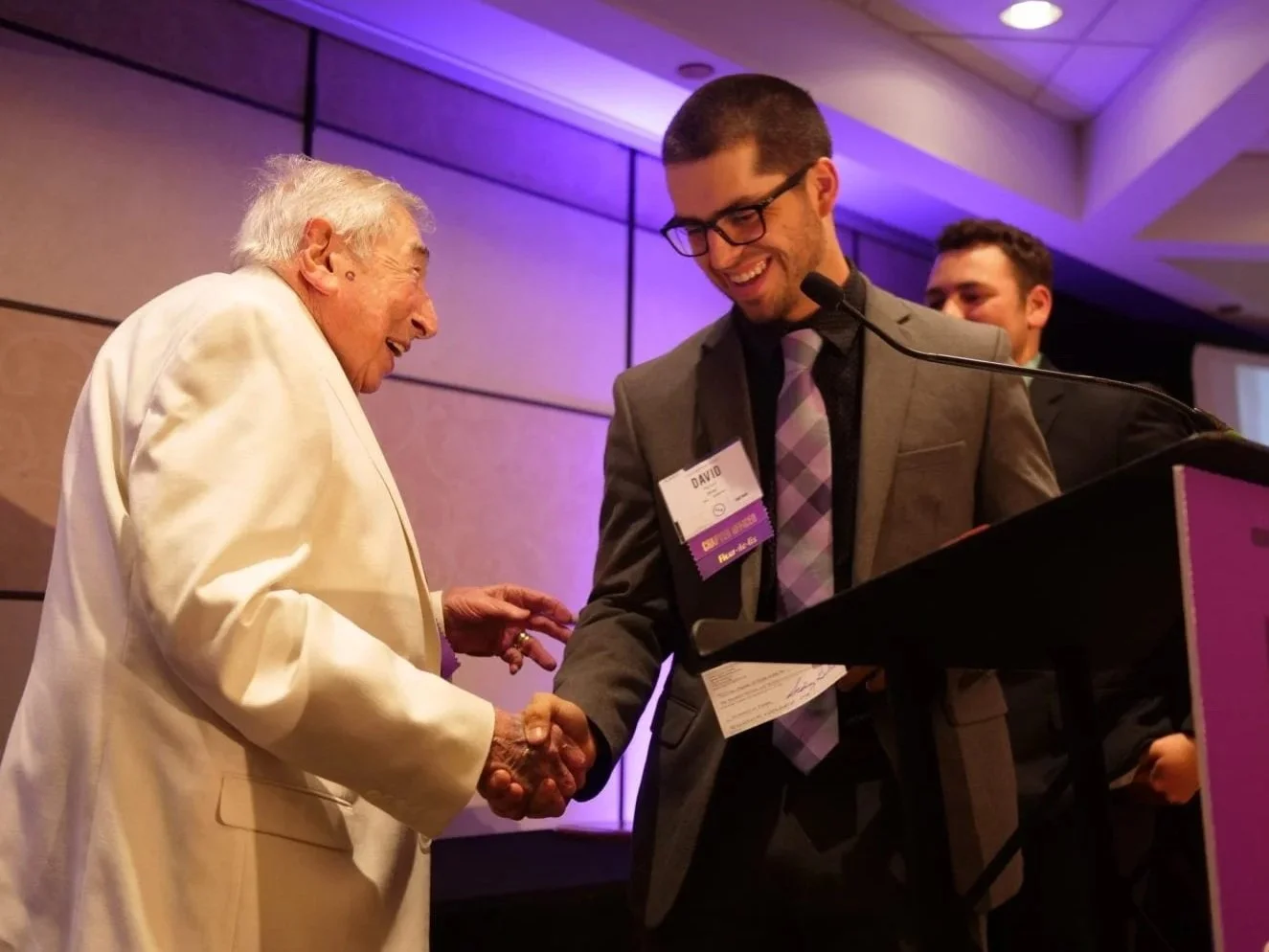 Sidney Guller giving out award to Young Scholar Recipient