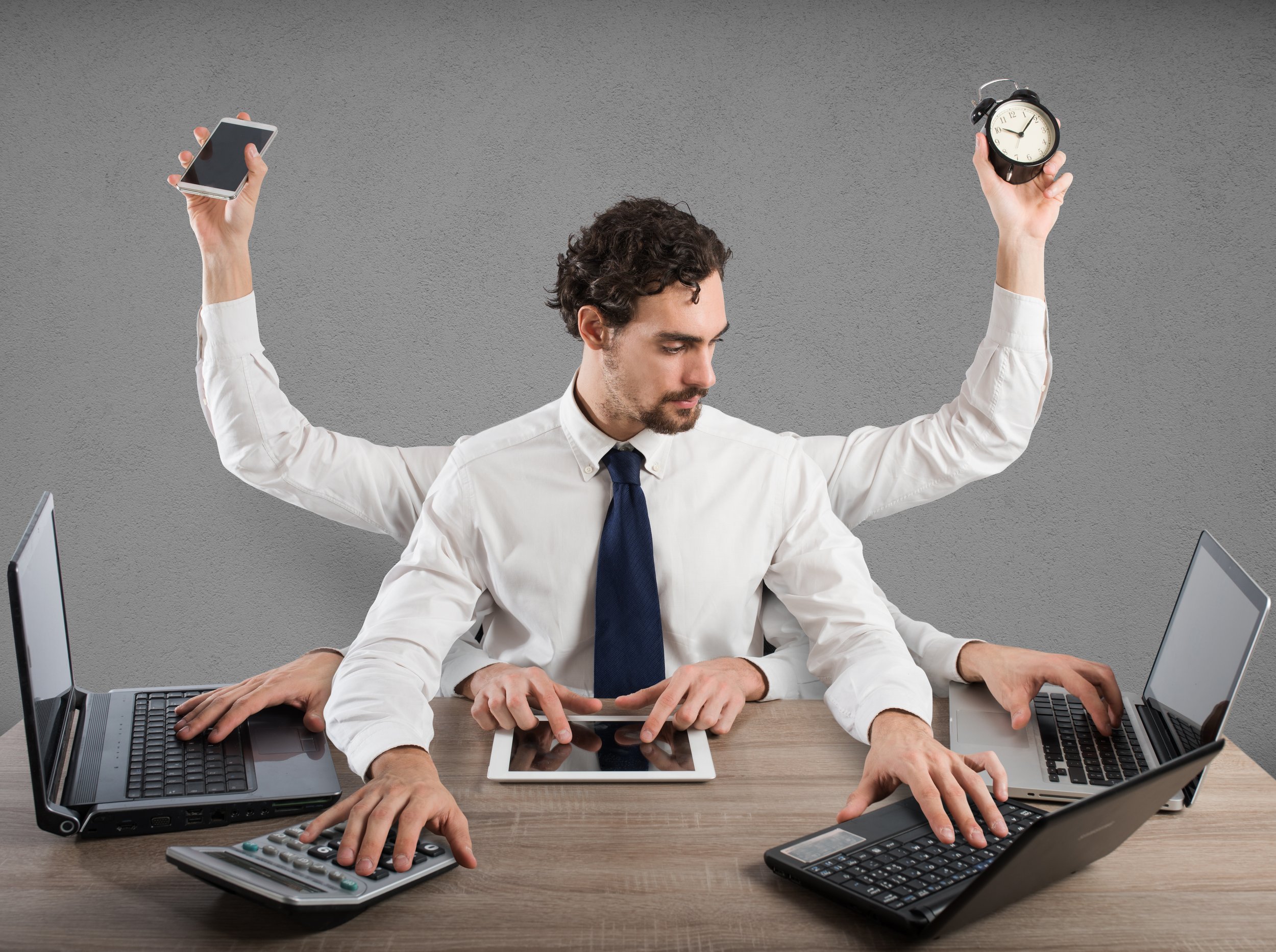 Overwhelmed business owner managing disconnected marketing and client acquisition efforts