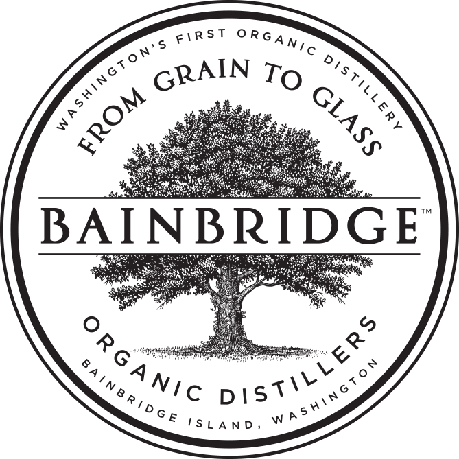 Bainbridge Organic Distillers logo featuring a large tree with surrounding text about their organic distillery on Bainbridge Island, Washington.