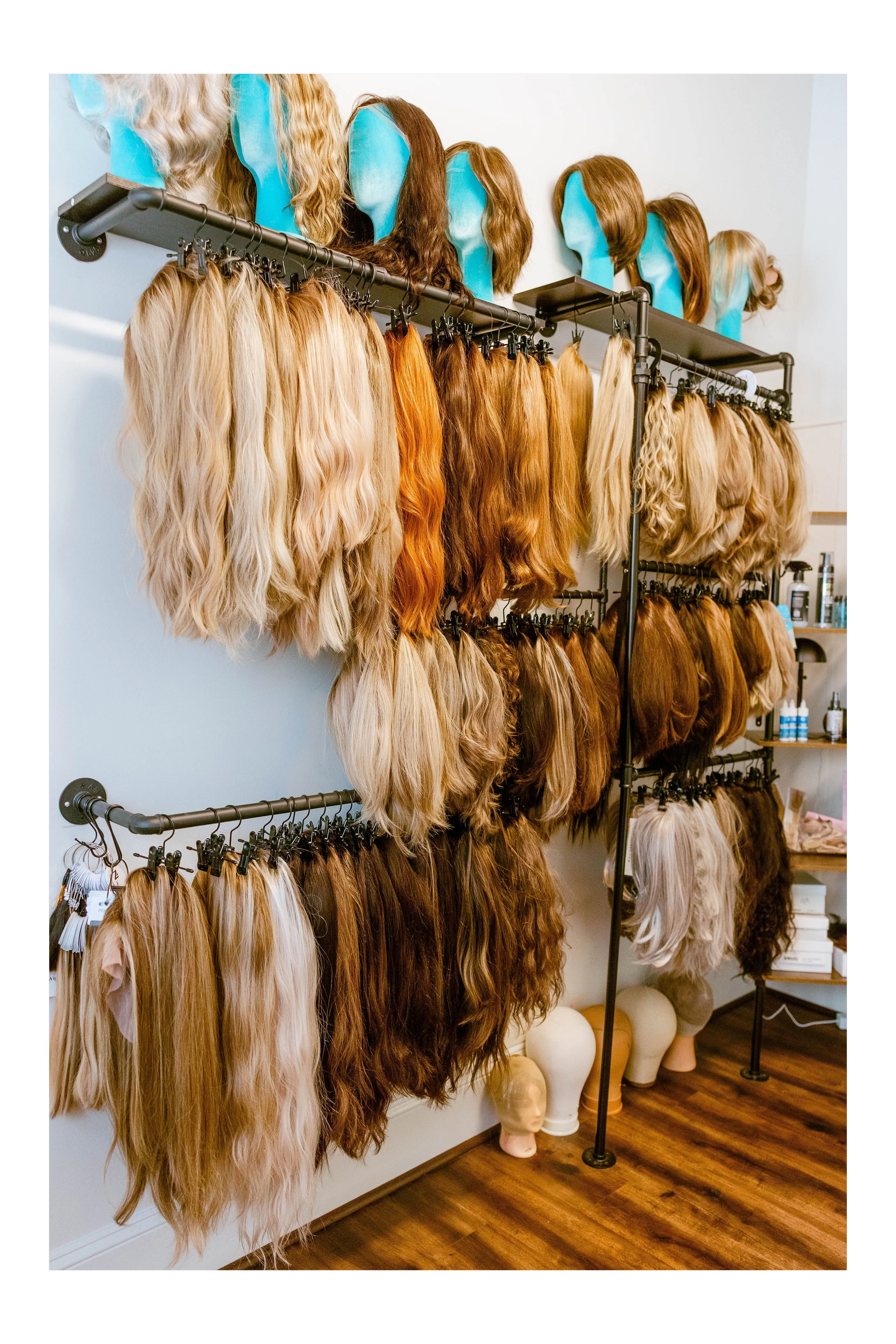 Here is an image of the bLUXE Wig Room in Medway, MA with a full selection of luxury human hair and synthetic wigs and toppers
