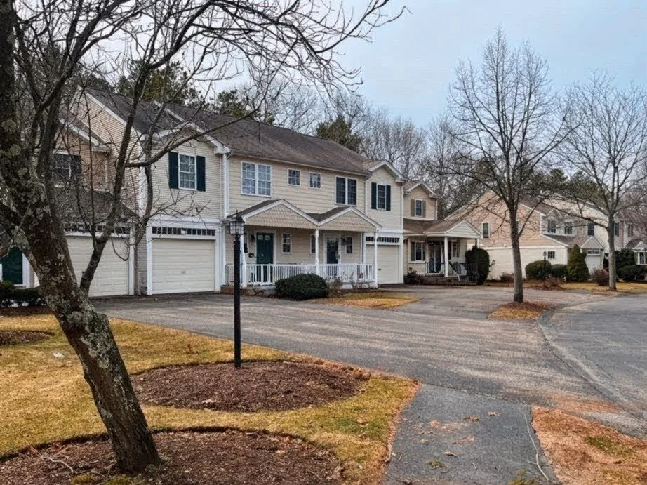 A row of suburban houses with attached garages in a residential neighborhood, 