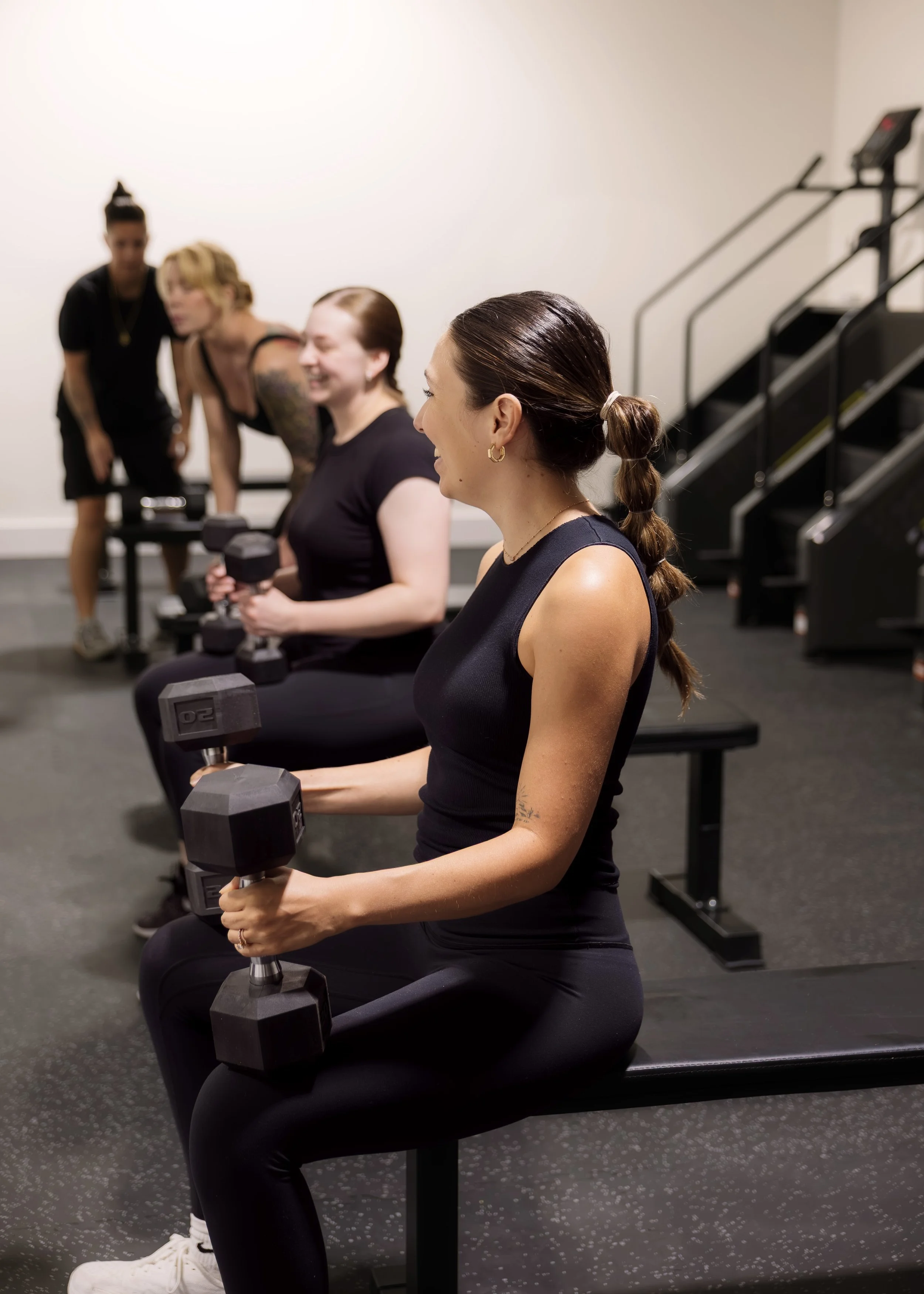 Members participating in a small group strength training class at Milo’s House, a private fitness studio in West Palm Beach, Florida.