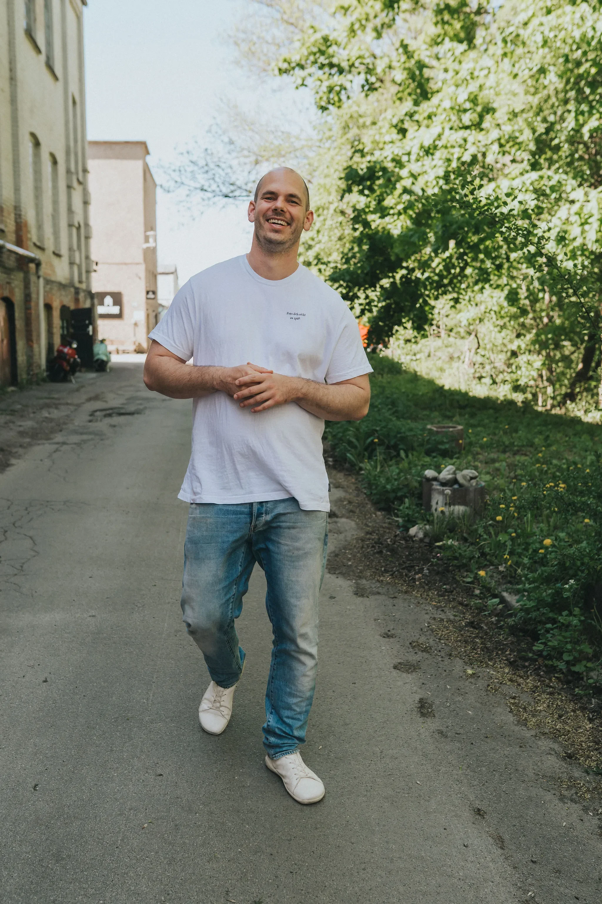 Tim Schröder walking outdoors, coach and former yoga studio owner and engineer.