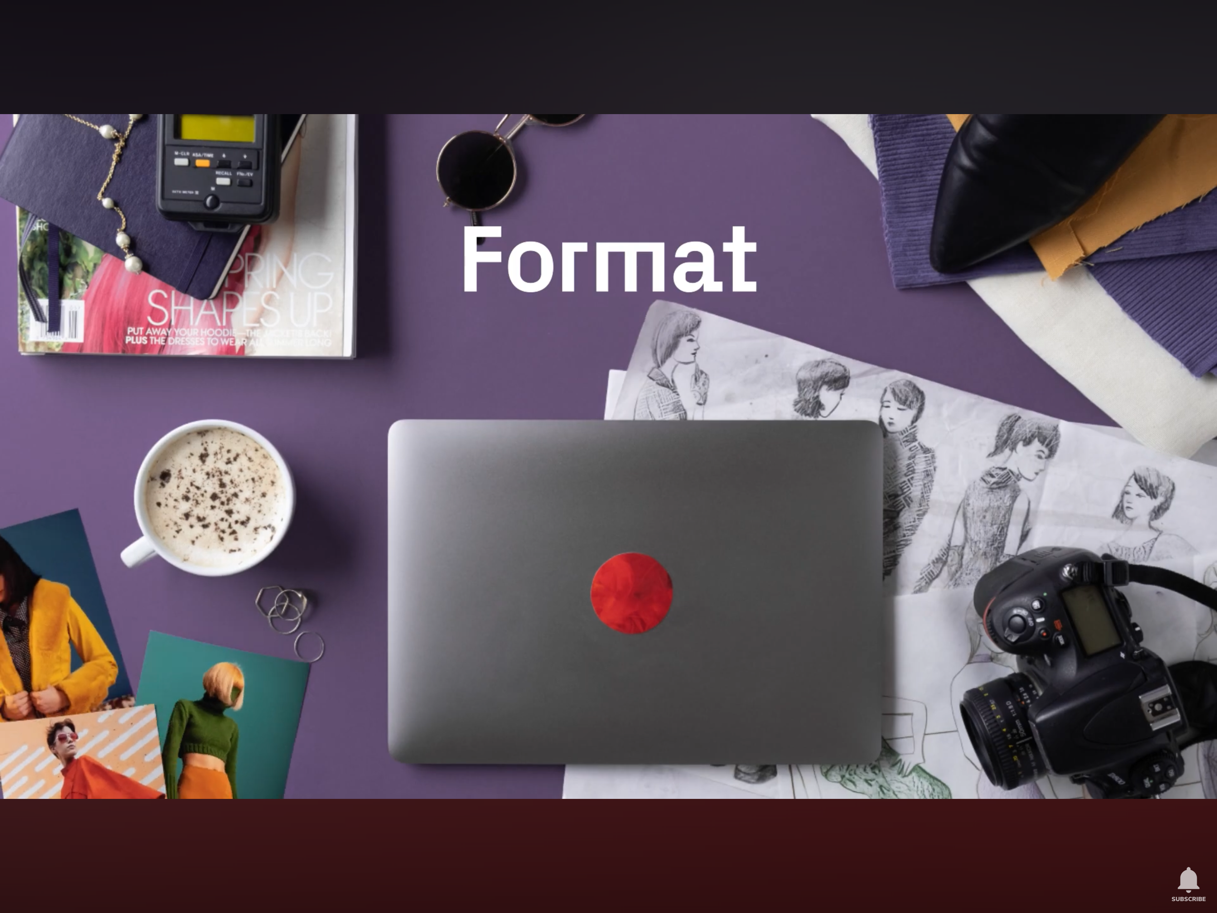 Top-down view of a purple desk with various items including a printer, coffee mug with foam and chocolate sprinkles, photos of women, camera, black high heel shoe, notebook, sunglasses, and a magazine. The word 'Format' is highlighted in center.