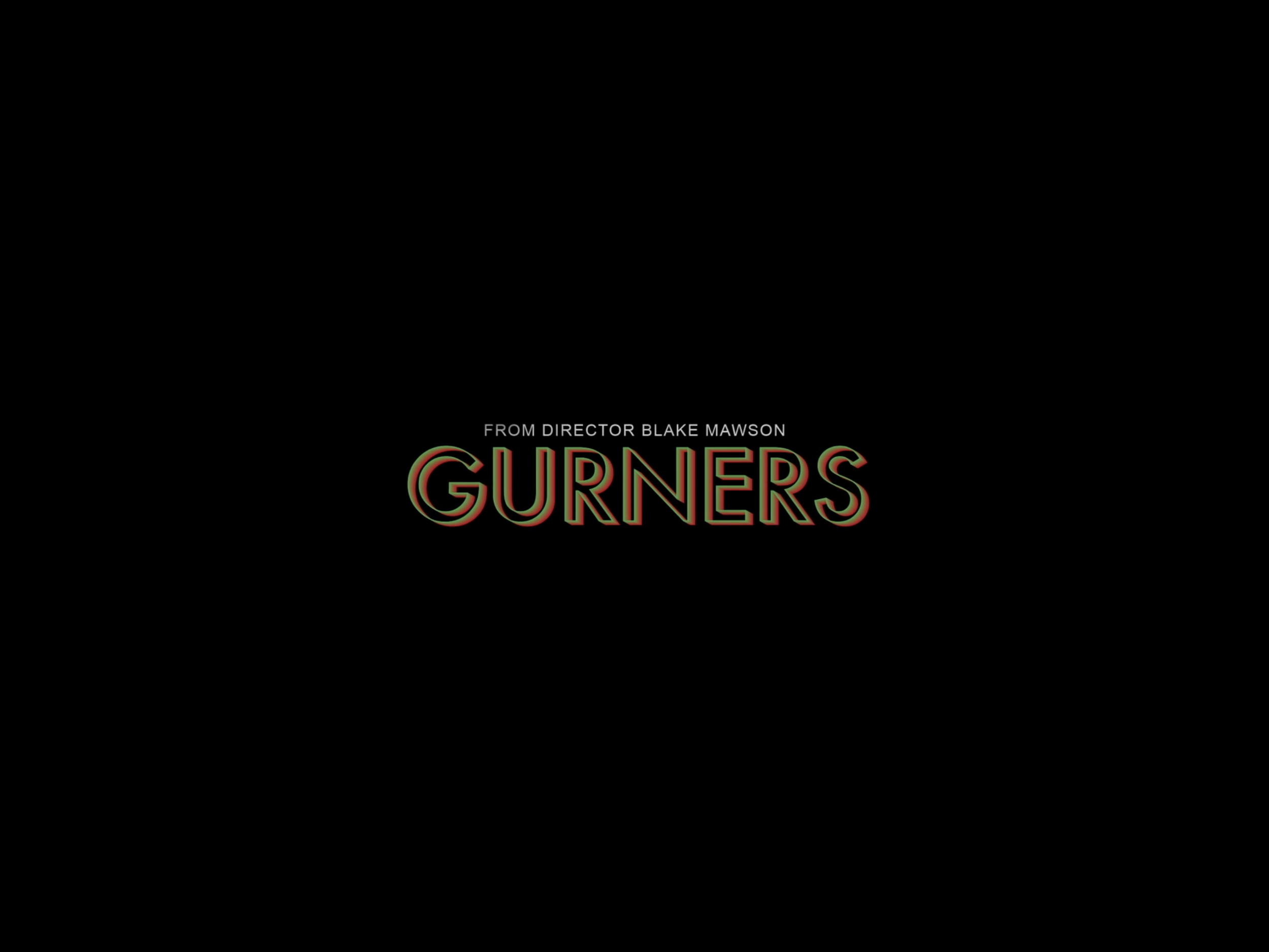 Title screen for the movie 'Gurners' with text message from director Blake Mawson, against a black background.