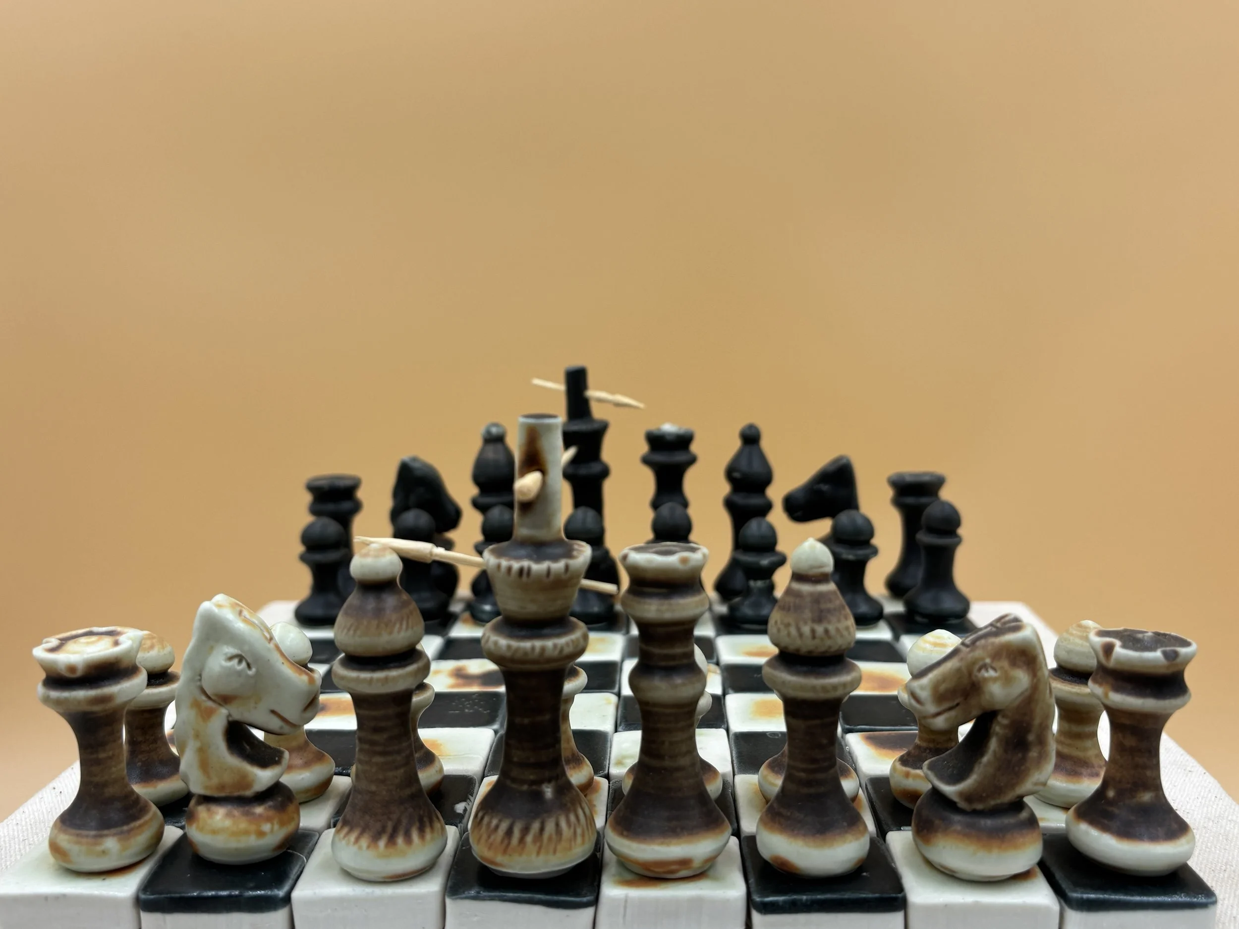 Orange tiger and satin black porcelain chess set