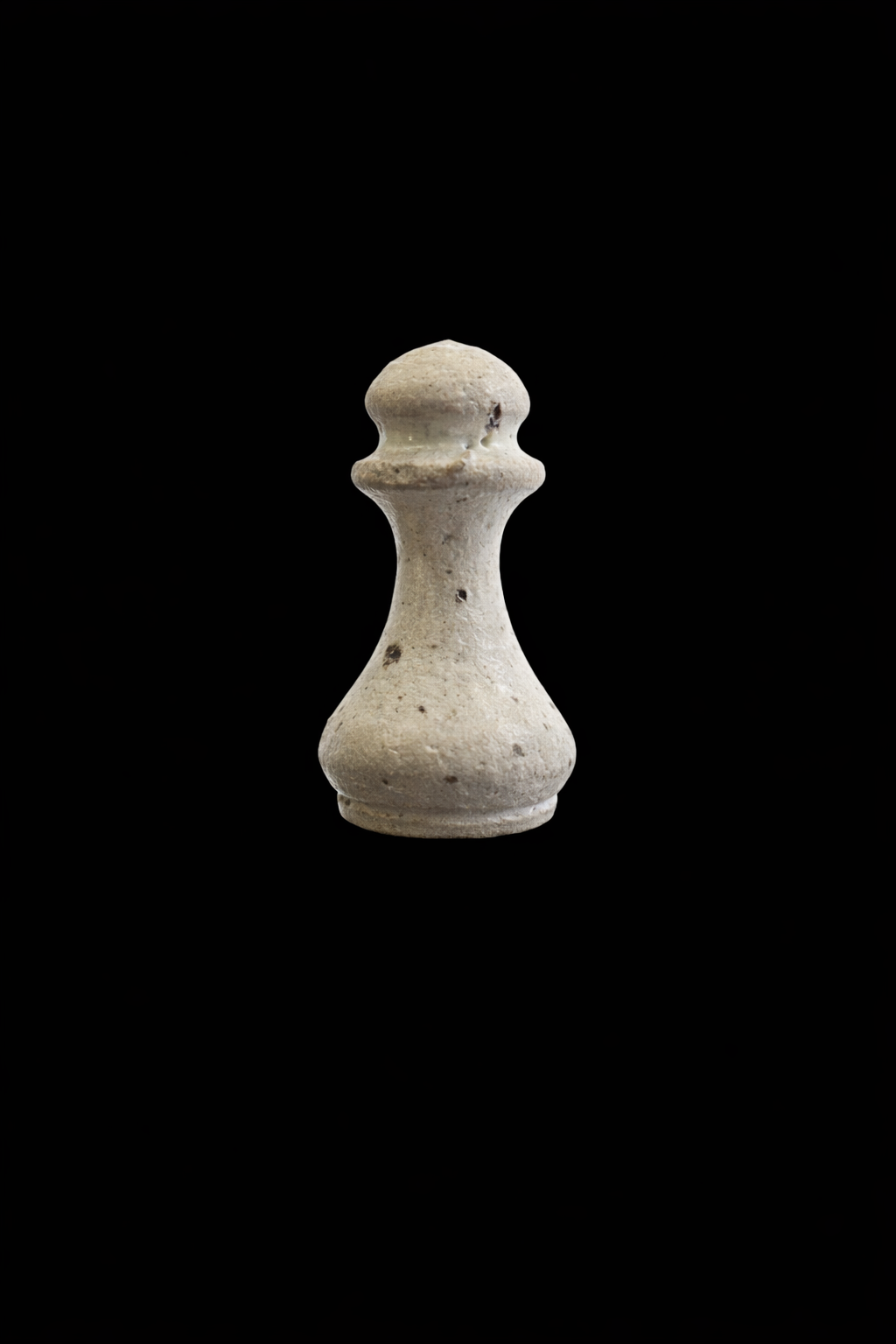 Chess pawn on black backdrop.png
