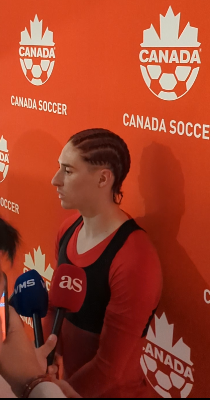 Marcelo Flores speaks to assembled media after his debut against Iceland
