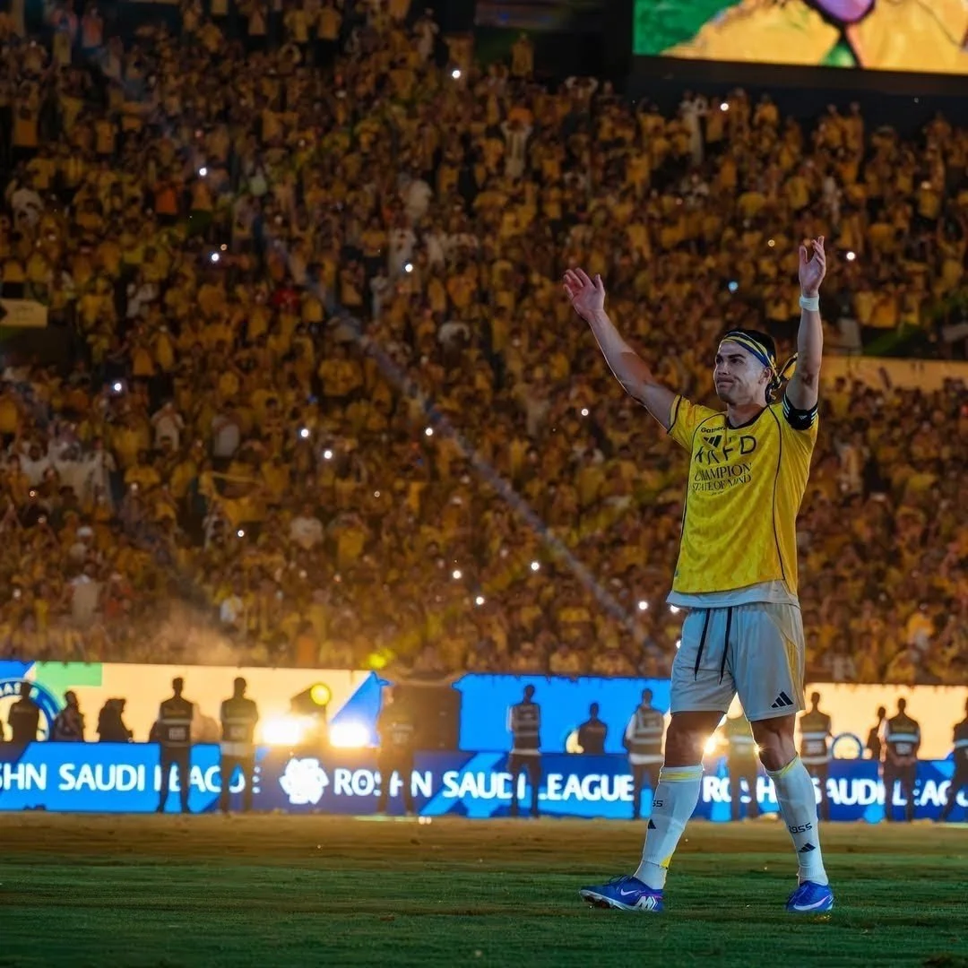 Al-Nassr captain Cristiano Ronaldo celebrates winning the 2026 Saudi Pro League with the fans of the club