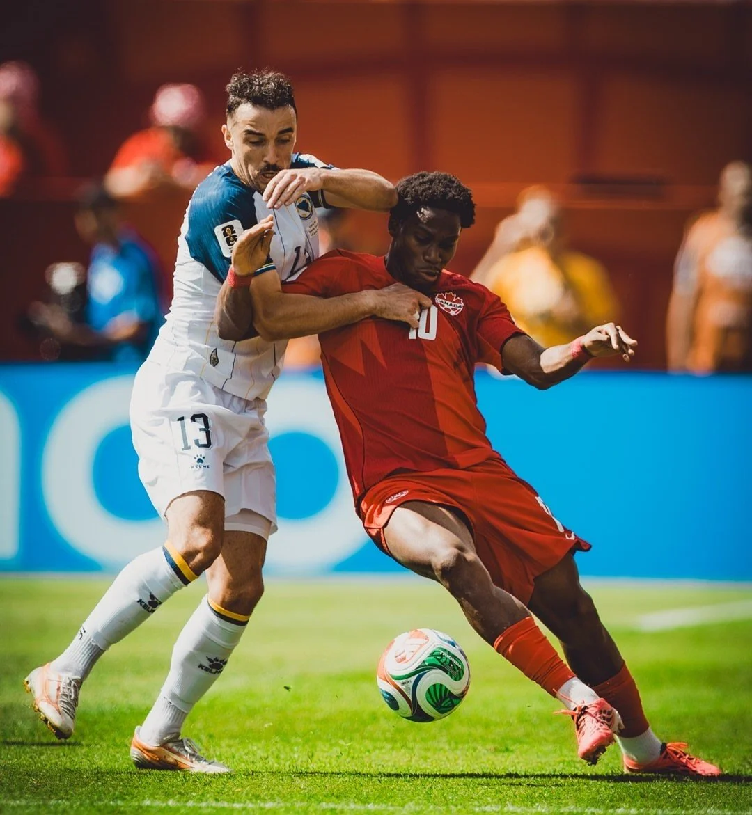 Bosnia’s Ivan Basic tussles with Canada’s Jonathan David
