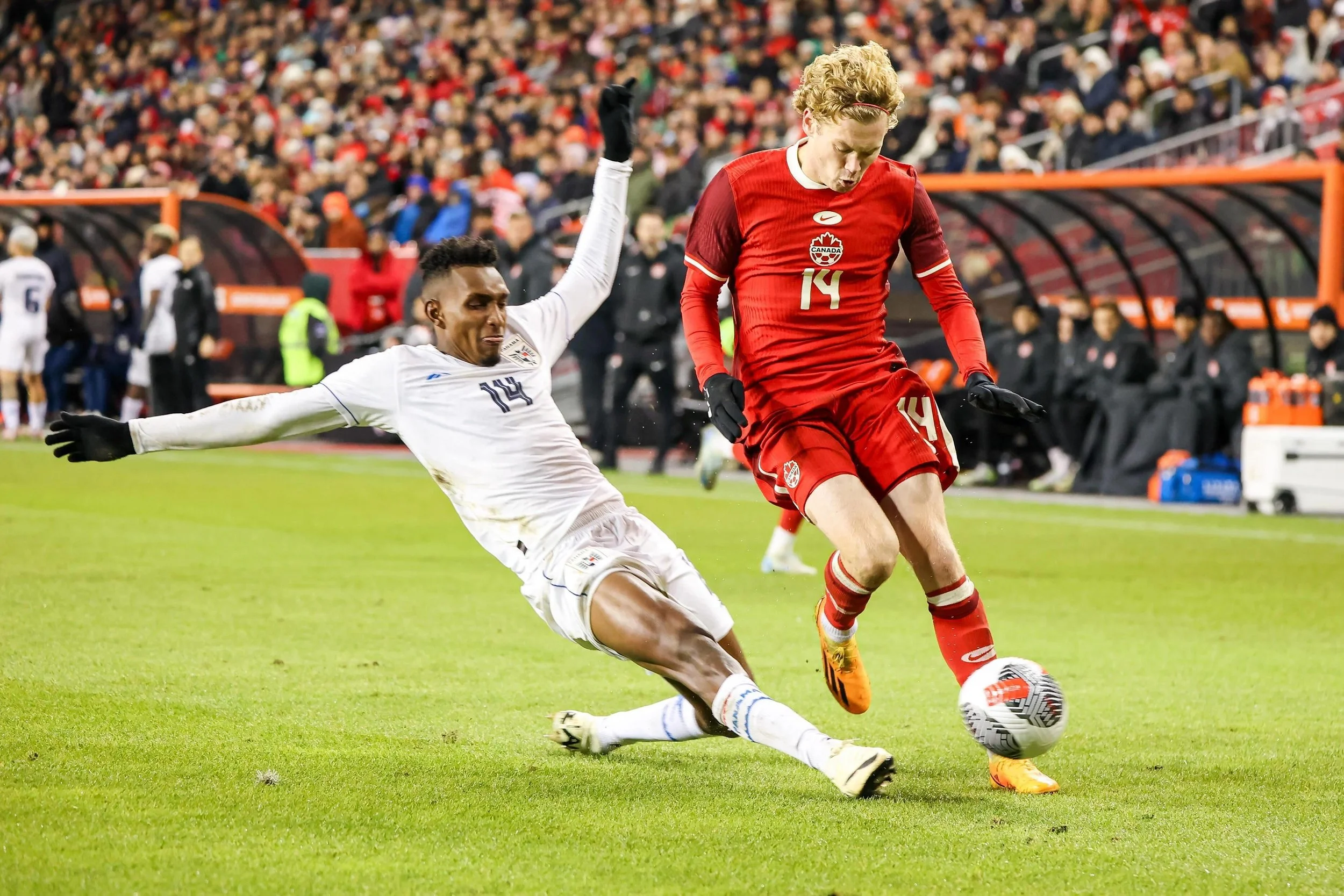 Panama defender Jiovany Ramos tackles Canada winger Jacob Shaffelburg in a friendly match in Toronto