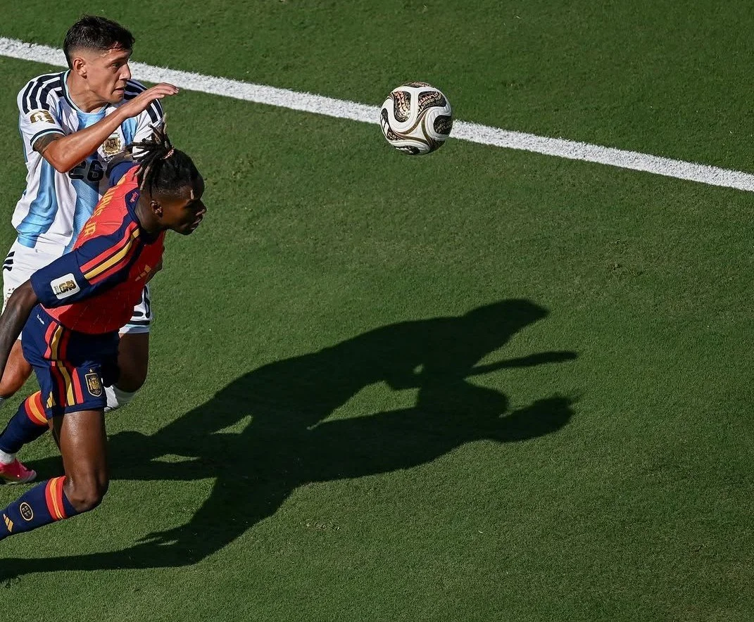 Argentina's Nahuel Molina and Spain's Nico Williams contest possession in the 2026 FIFA World Cup Final