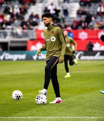 Jonathan Osorio warming up prior to an international match against Iceland