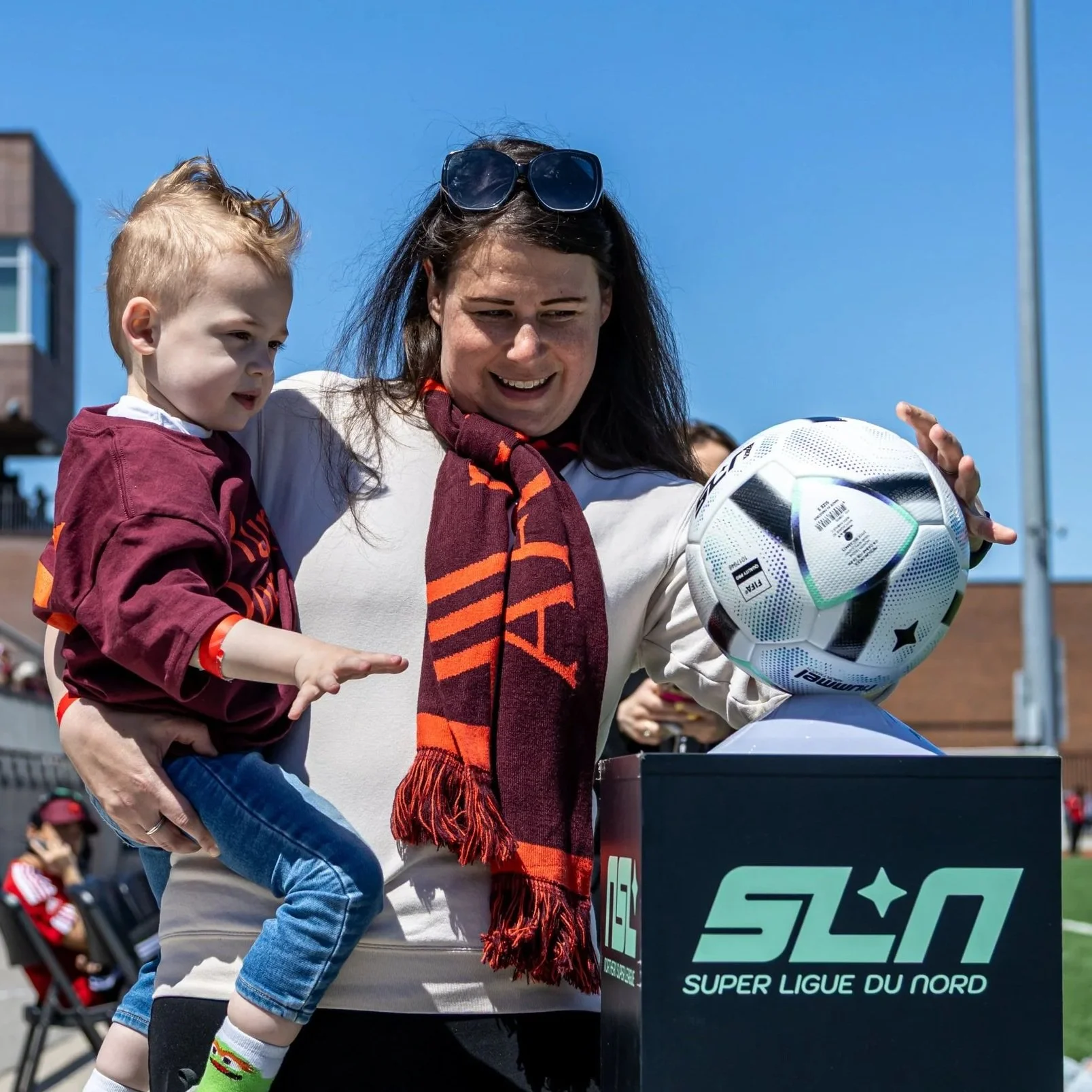 A mother and child with the match ball from AFC Toronto v Vancouver Rise. Happy Mother's Day!