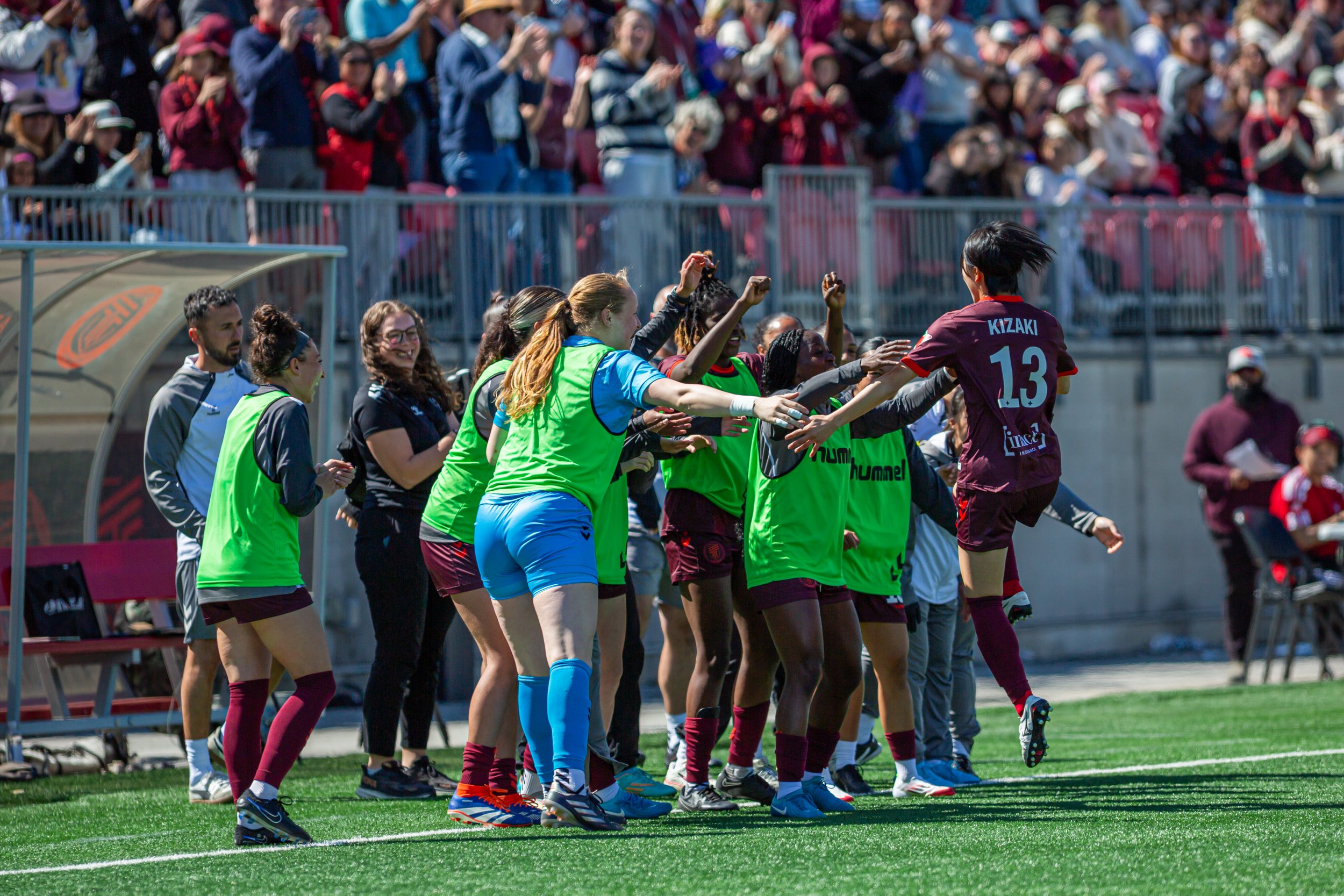 AFC Toronto players celebrate a goal against Vancouver Rise