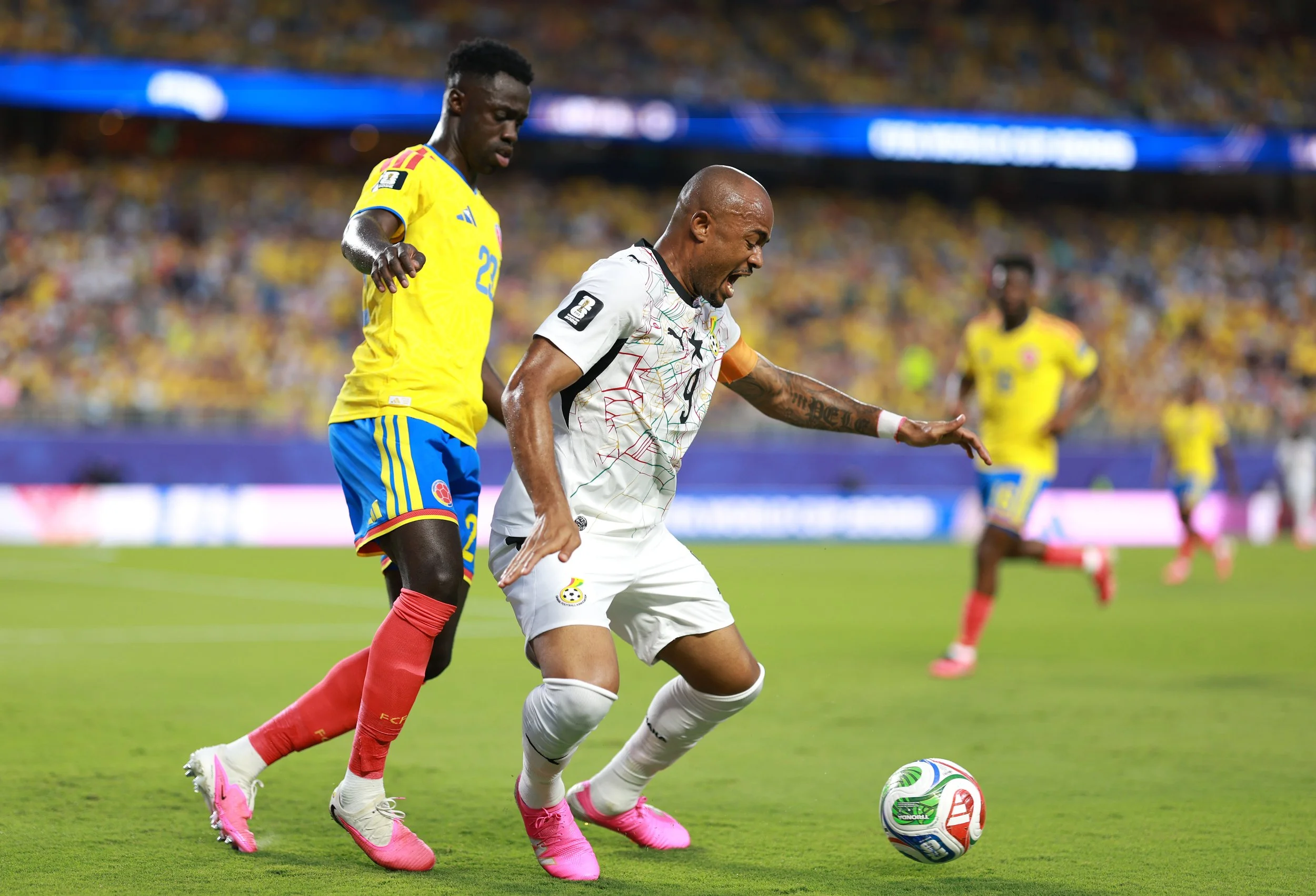 Davinson Sánchez of Colombia closely monitors Jordan Ayew of Ghana in the Round of 32 of FIFA World Cup 2026