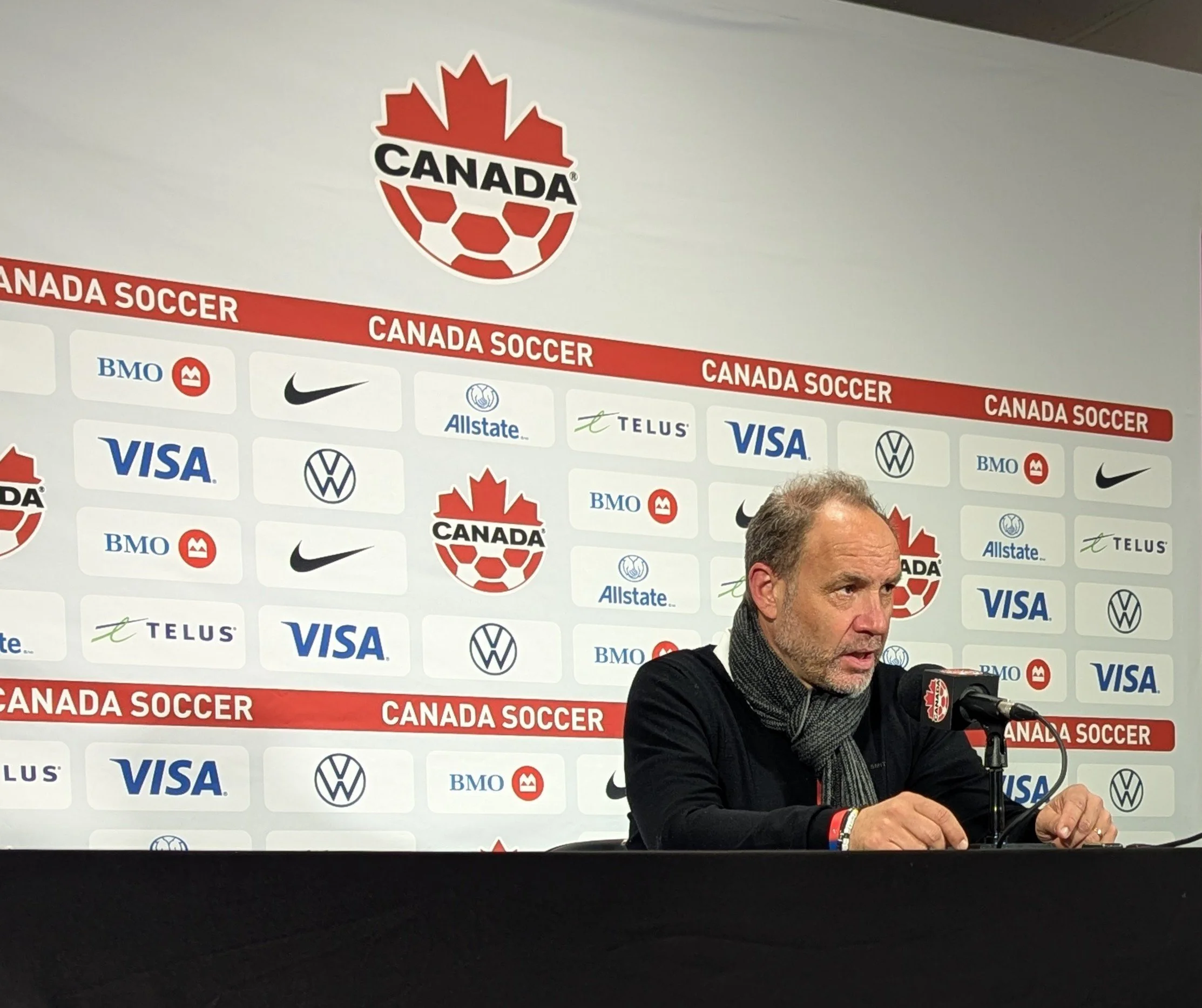 Sébastien Migné speaks to the press after a Haiti friendly match against Tunisia.