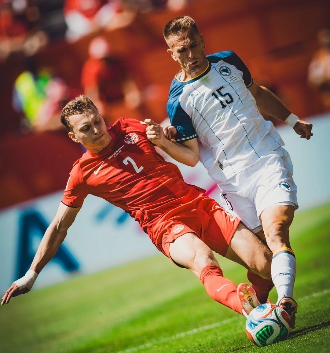 Canada’s Alistair Johnston challenges Bosnia’s Amar Memic