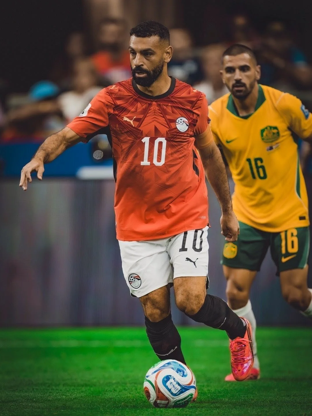 Egyptian captain Mohamed Salah is pursued by Aziz Behich of Australia in the Round of 32 of FIFA World Cup 2026