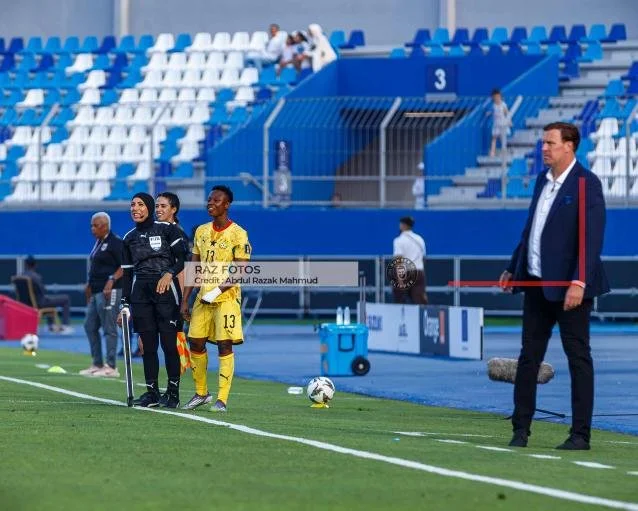 Ghanaian midfielder Evelyn Badu waits to enter the 2026 WAFCON match against Cabo Verde as coach Lars Kim Bjorkegren looks on