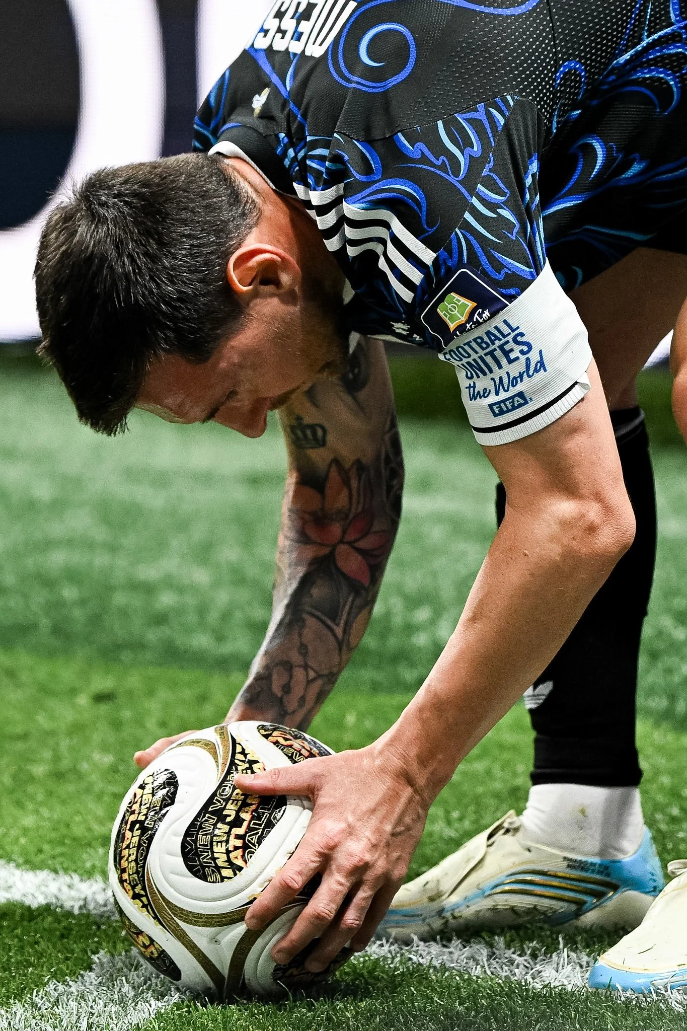 Argentina captain Lionel Messi places the ball on the field as he prepares to take a corner in a FIFA World Cup semi-final against England