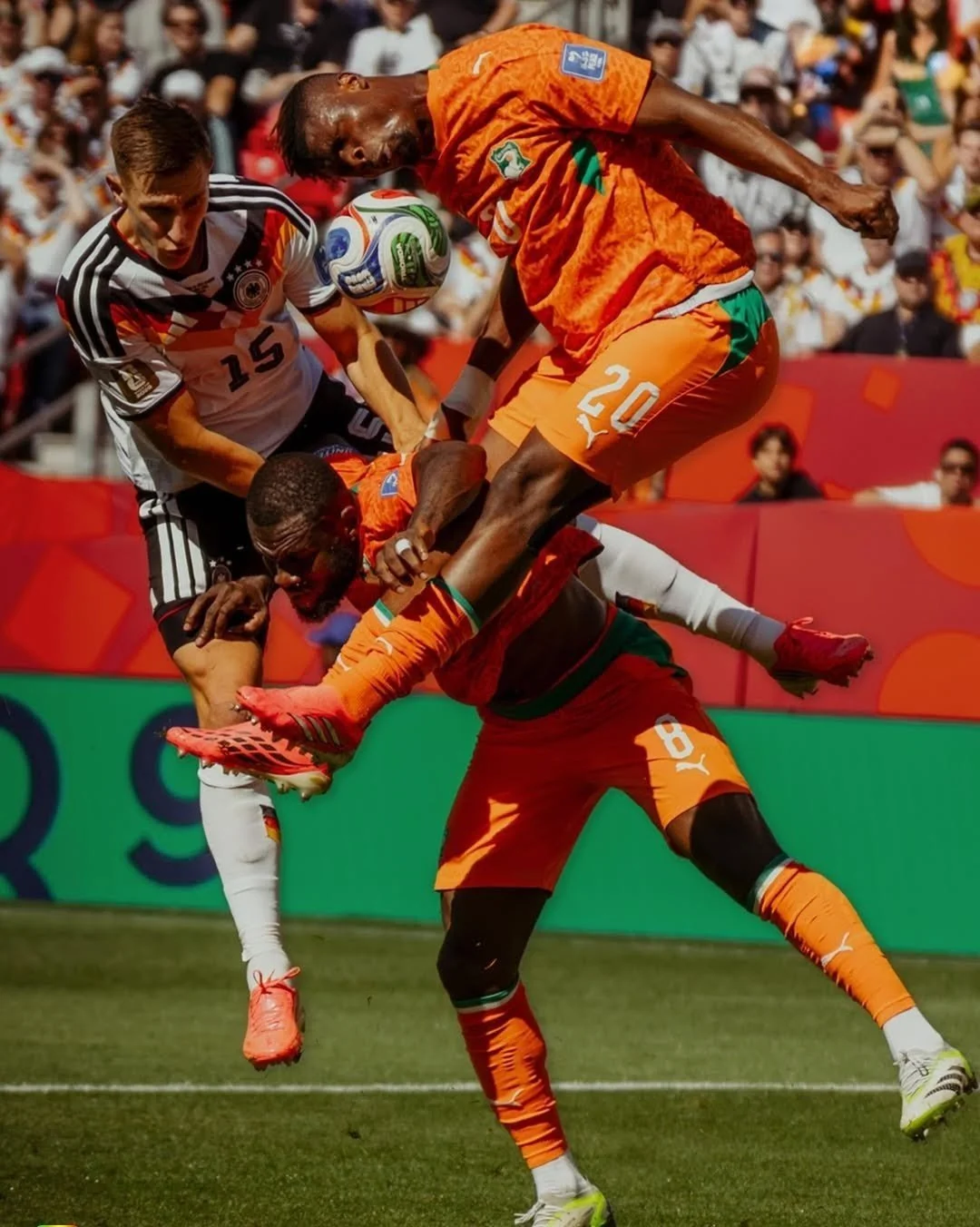 Germant's Nico Schlotterbeck contests and aerial ball with Franck Kessie and Emmanuel Agbadou of Côte d’Ivoire at the FIFA World Cup in Toronto