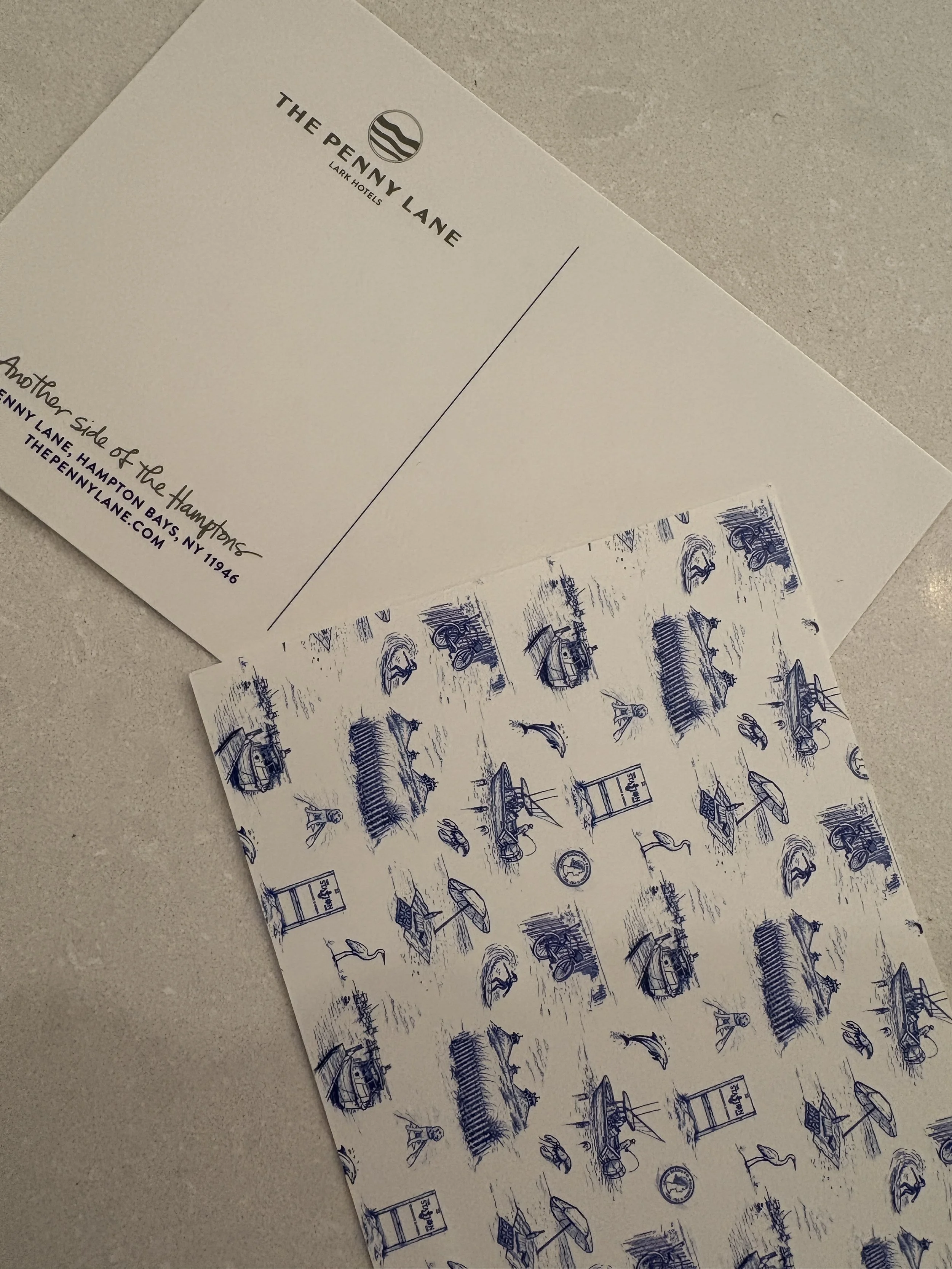 A postcard featuring the logo and address for The Penny Lane, a hotel in the Hamptons, NY. The postcard also includes blue line drawings of various outdoor scenes and objects.
