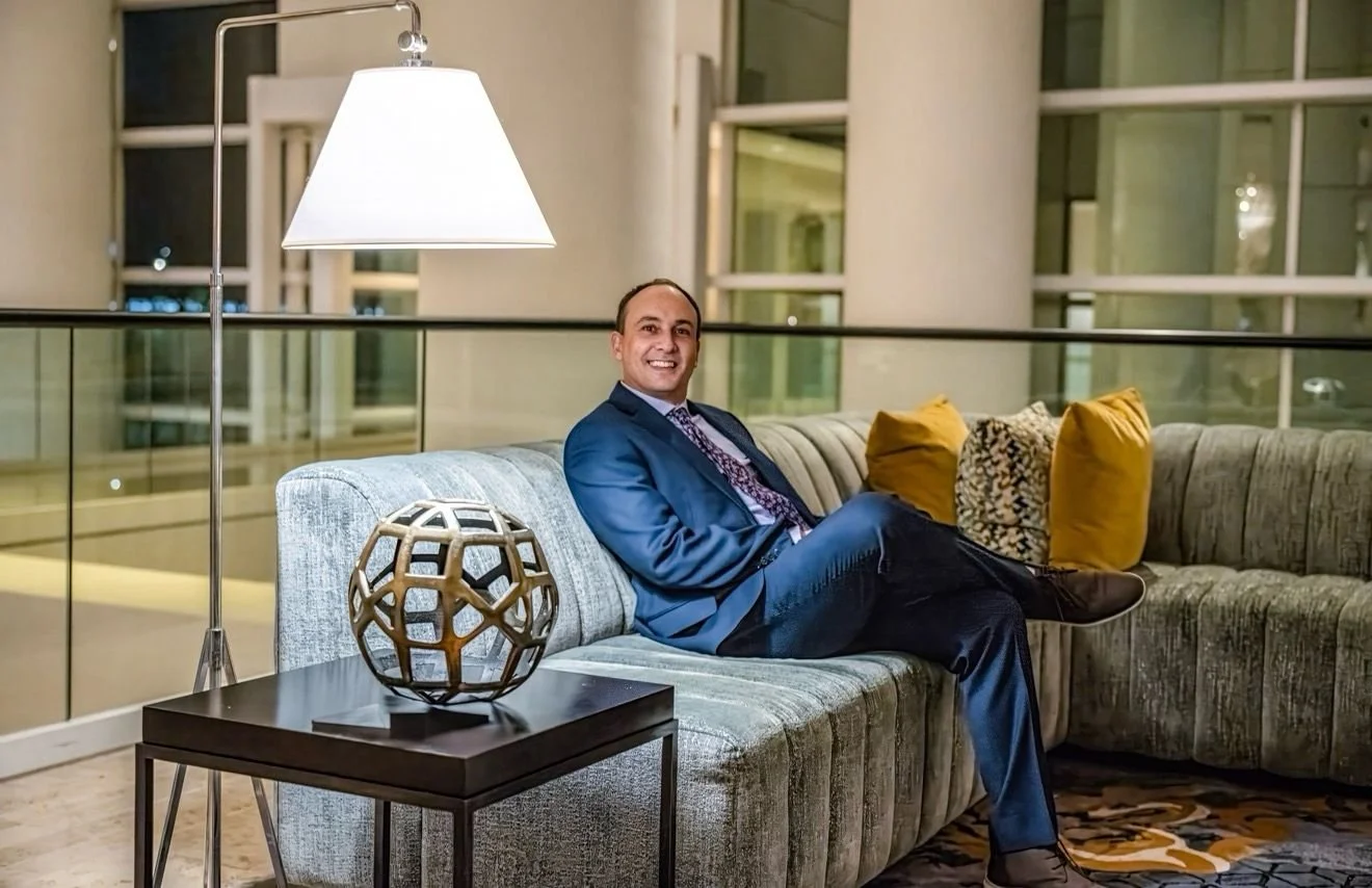 Headshot of smiling female tutor with short blonde hair wearing a lanyard.