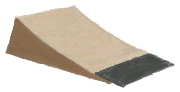 A skateboarding ramp with a beige surface and black end.