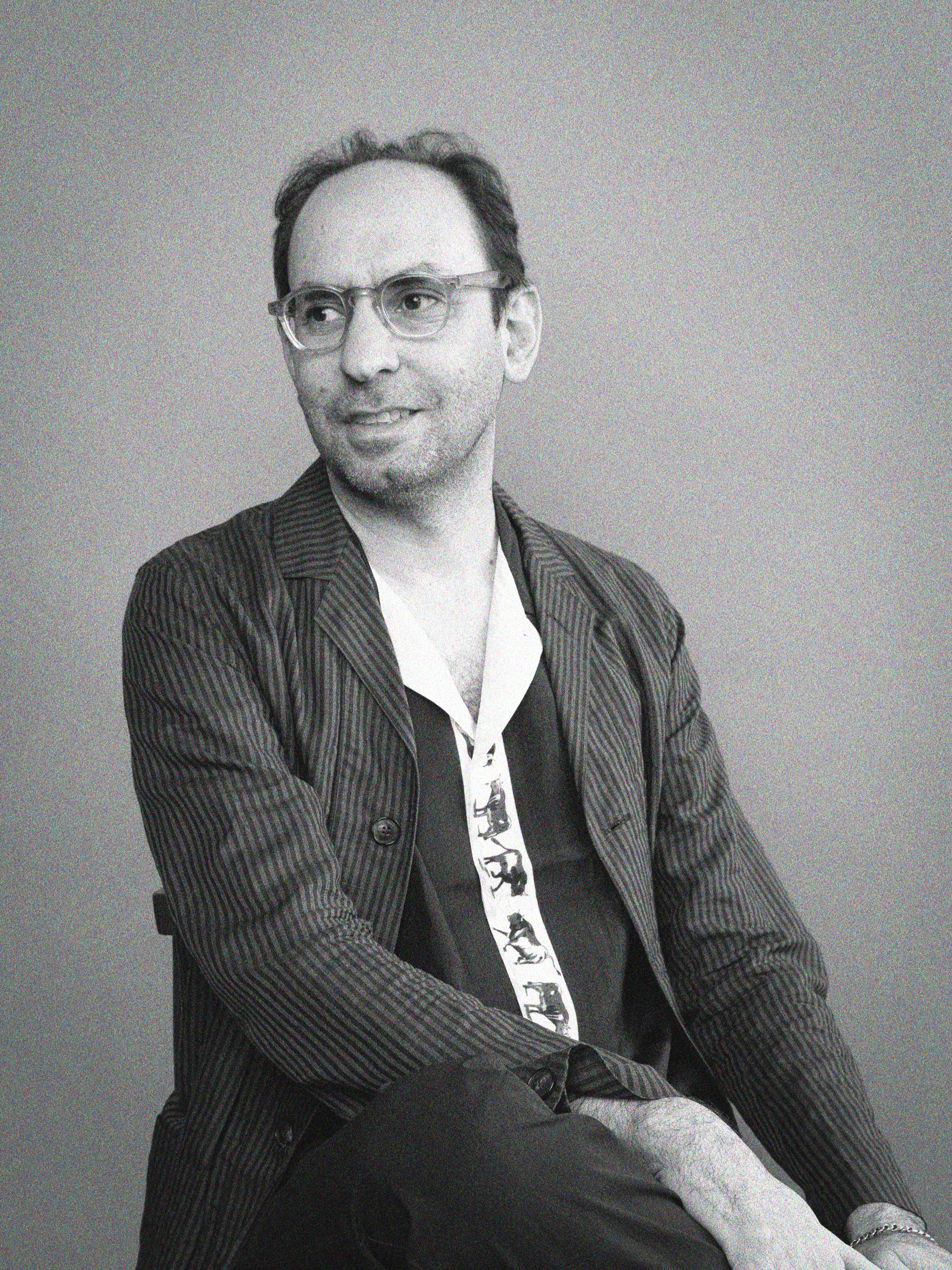 Black and white of Rami Gabriel, musical artist, composer, producer, and scholar.