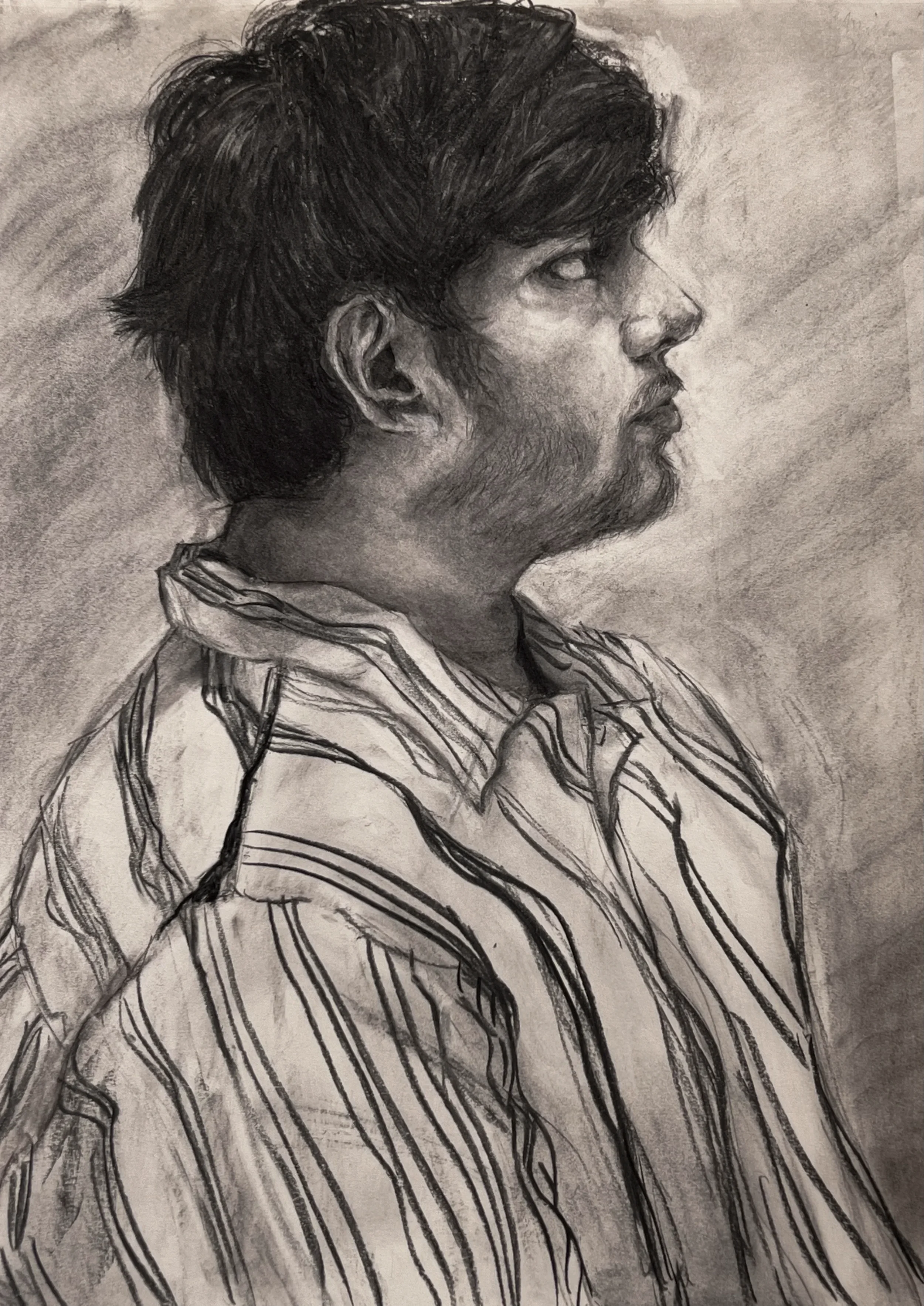 Portrait of Sid, 2025, charcoal on drawing paper, 24 x 18 in.