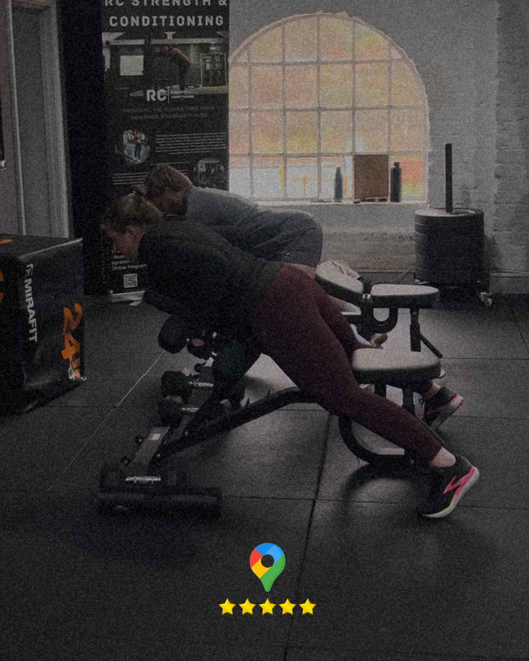 A lady training in the gym, next to a younger male during a personal training session in Stroud.