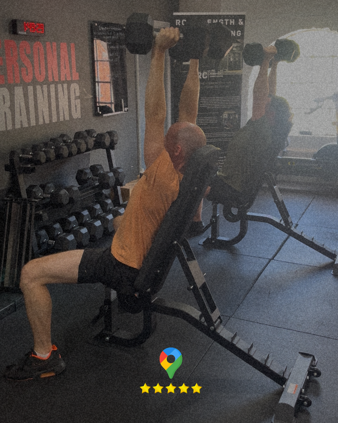 A 35 year old male, strength training in stroud. Lifting dumbells over head..