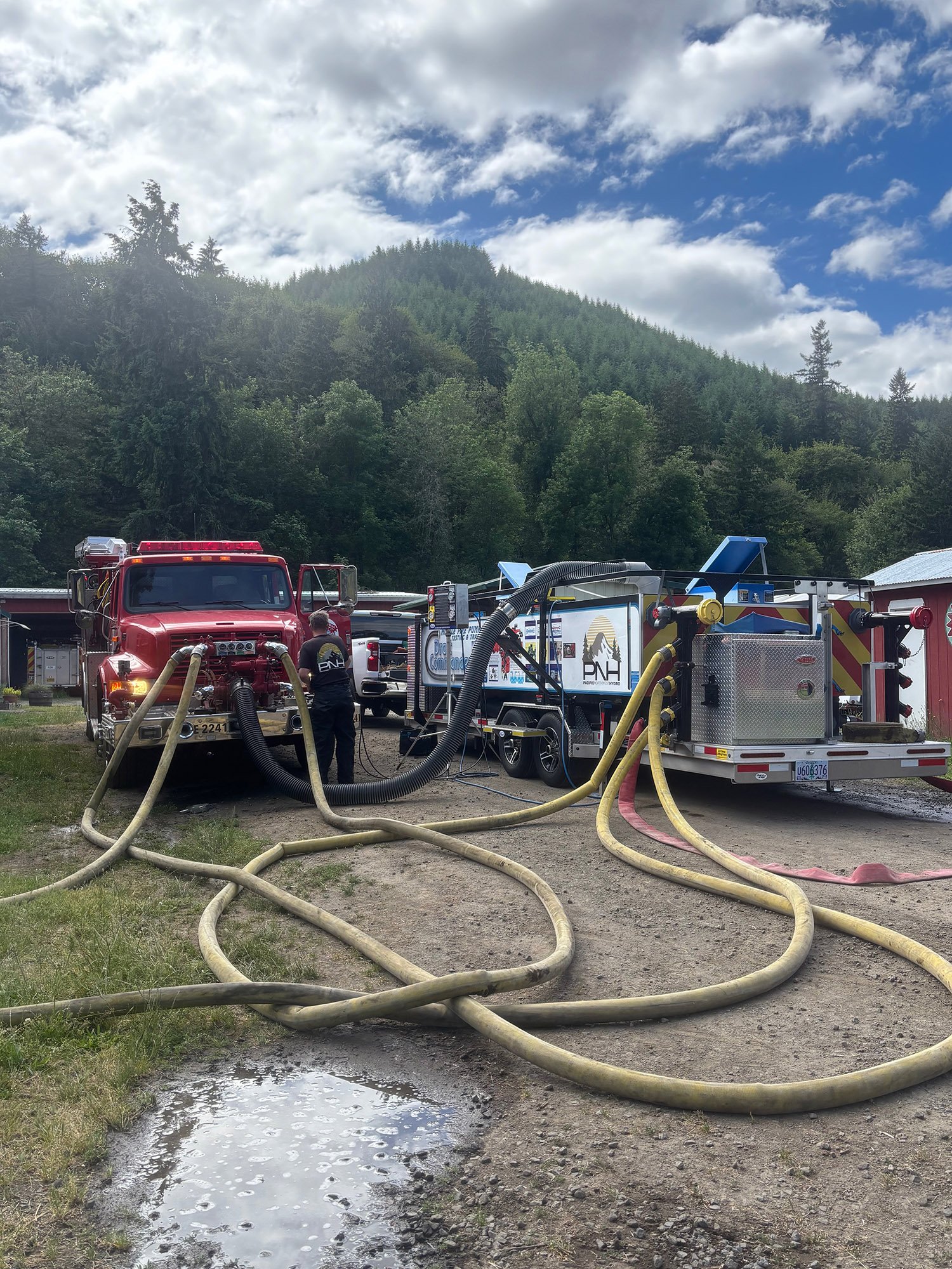 Fire trucks with hoses 2.jpg
