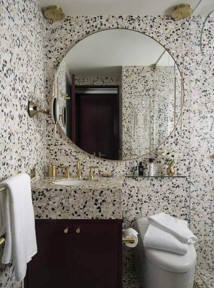 Round mirror above bathroom vanity