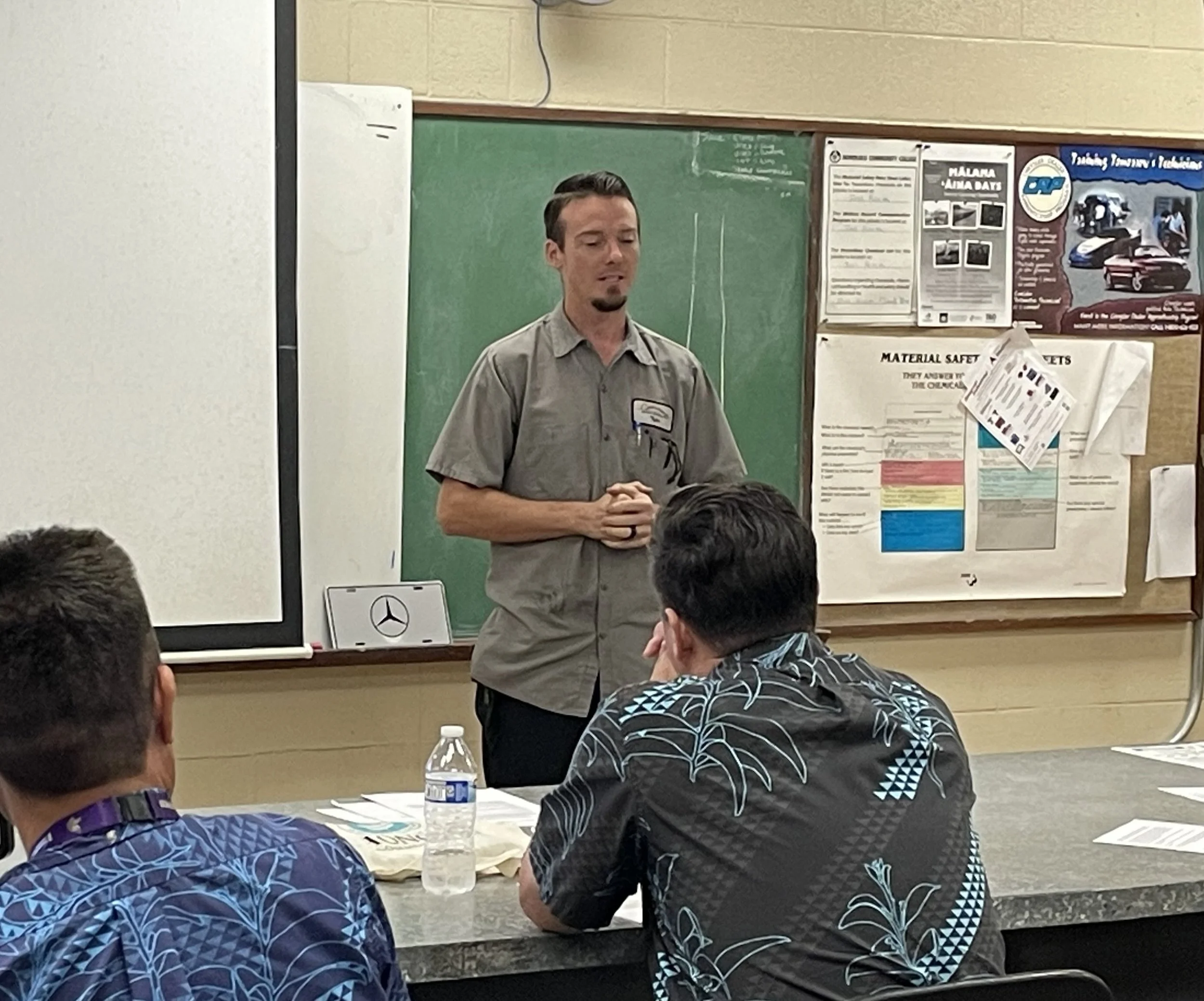 Automotive alumus speaking in front of class