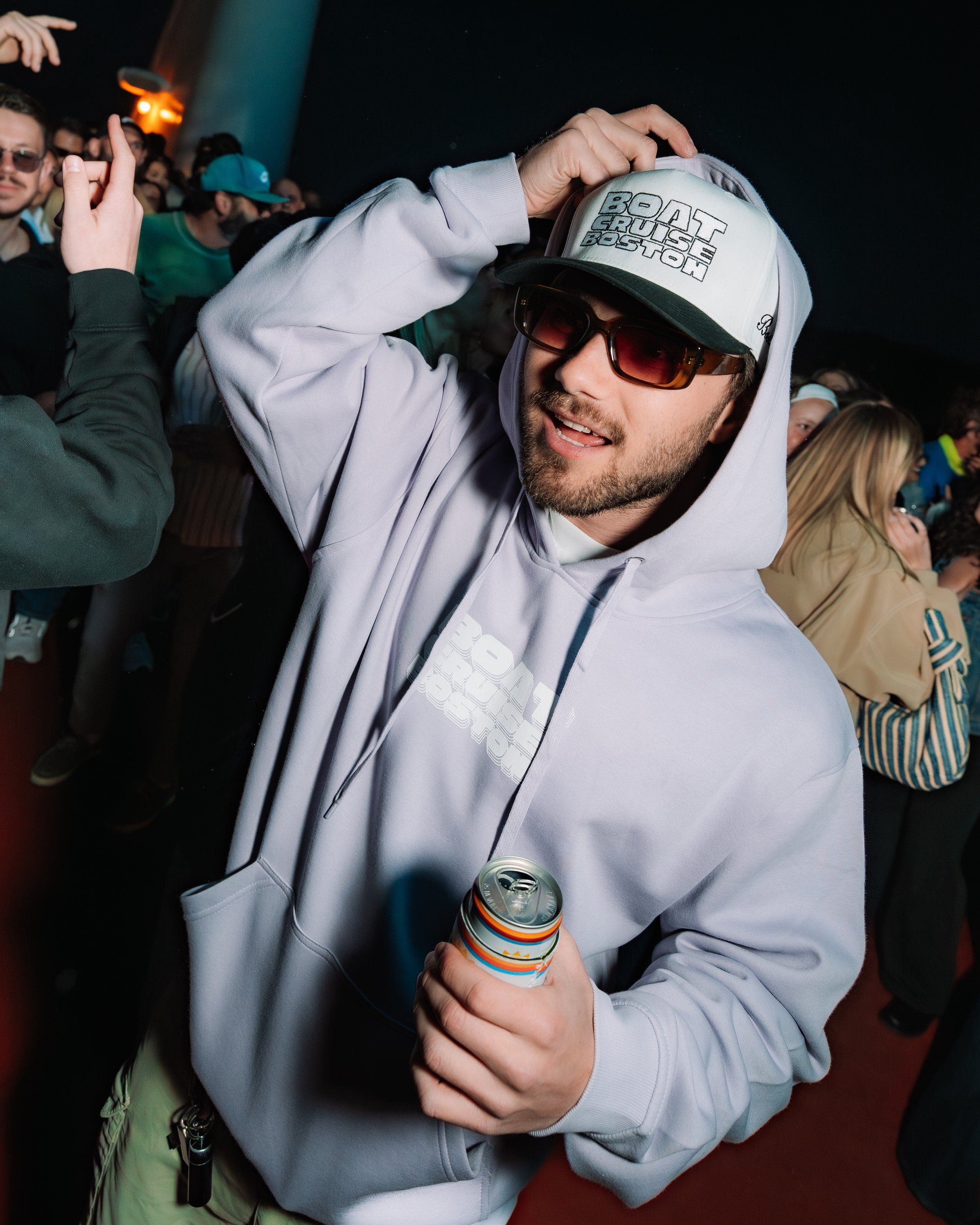 Boat Cruise Boston merch a sweatshirt and a hat