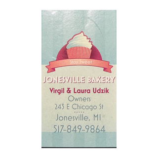 Bakery business card with cupcake illustration, includes company name Jonesville Bakery, owner names Virgil and Laura Udzik, address 243 E Chicago St, Jonesville, MI, and phone number 517-849-9864.
