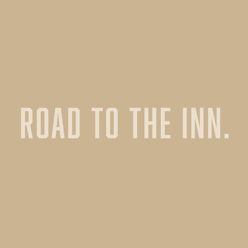 Text on a beige background that reads 'Road to the Inn.'