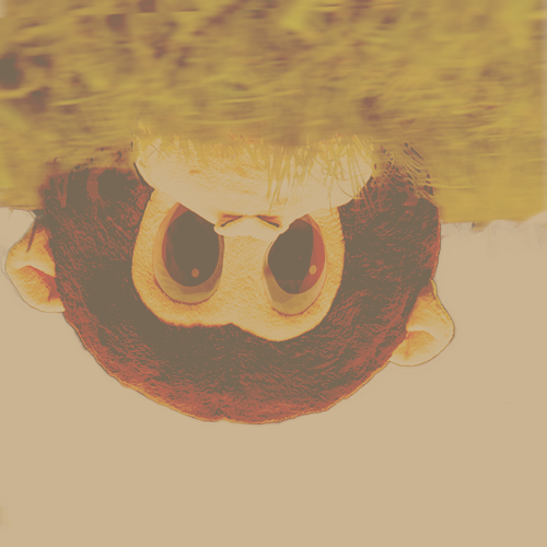 A child's face reflected upside down in water with large eyes and curly hair